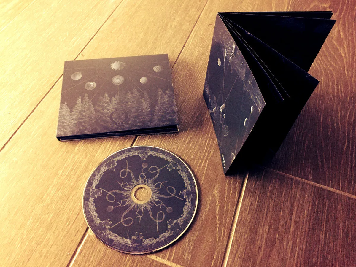 Omega Eve CD digipak 16-siders booklet